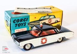 Corgi No.237 Oldsmobile "County Sheriff" Car - black, white, red interior and roof-light, chrome spun hubs - Excellent example in an excellent blue and yellow carded picture box with collectors club folded leaflet.