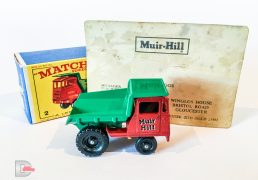 Matchbox Regular Wheels No.2c Muir Hill Site Dumper "Muir Hill" - red cab and chassis without silver grille - Mint in Mint correct issue type E3 box. Comes with an old business card belonging to E.L Briggs who was the manager of the publicity department at Muir Hill who originally ordered these models as promotional items to be given out by sales reps. This model was purchased from the family.