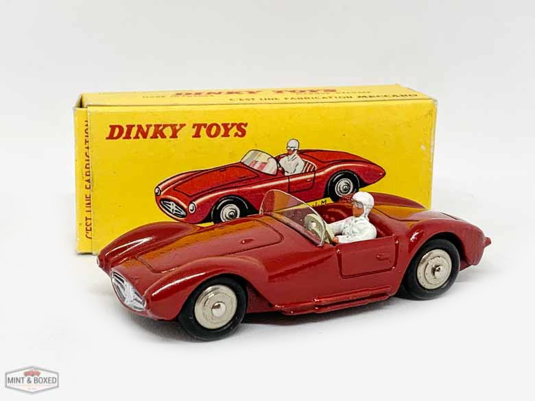 French Dinky No.22A Maserati Sport 2000 - dark red, white driver, convex steel hubs - Excellent Plus to near mint in Excellent plus card box, would be mint apart from biro price to end flap.