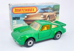 Matchbox Superfast 3c Porsche 911/930 Turbo - metallic emerald green body (slightly lighter shade), clear windows, 5-arch wheels light yellow interior, gloss black base; Excellent Plus with some factory assembly marks/chips to base in Excellent to Excellent Plus "New" type K box.