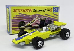 Matchbox Superfast 34a Formula 1 Racing Car - lemon yellow body, bare metal base, Maltese Cross front wheels & 5-spoke rear wheels yellow stripe racing number 16 nose label, clear windscreen - Excellent plus in Excellent plus near mint type G box without "New"