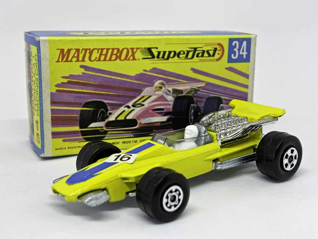 Matchbox Superfast 34a Formula 1 Racing Car - lemon yellow body, bare metal base, Maltese Cross front wheels & 5-spoke rear wheels yellow stripe racing number 16 nose label, clear windscreen - Excellent plus in Excellent plus near mint type G box without "New"