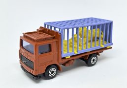 Matchbox Superfast No.35c Volvo Zoo Truck - red body, blue windows, light blue plastic cage with lemon yellow lions, black plastic grille & base, Near Mint, Unboxed.