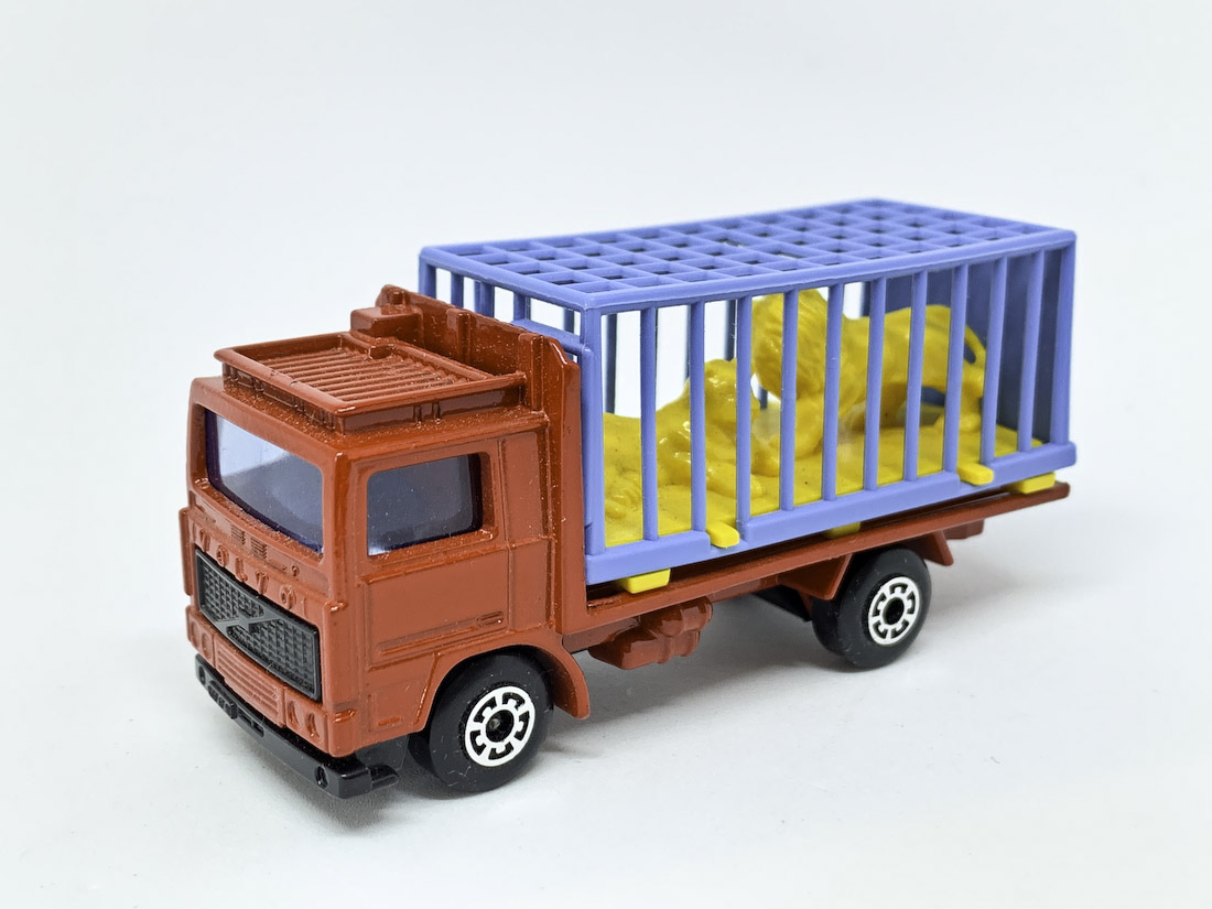 Matchbox Superfast No.35c Volvo Zoo Truck - red body, blue windows, light blue plastic cage with lemon yellow lions, black plastic grille & base, Near Mint, Unboxed.