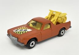 Matchbox Superfast 60d Holden Pick-up Truck (Superfast 60c) - red body with racing number 500 hood label, light amber windows, pale yellow interior, dark yellow Motorcycles with racing numbers 9 & 12, bare metal base with "gunmetal" effect, dot-dash wheels. Mint condition, unboxed.